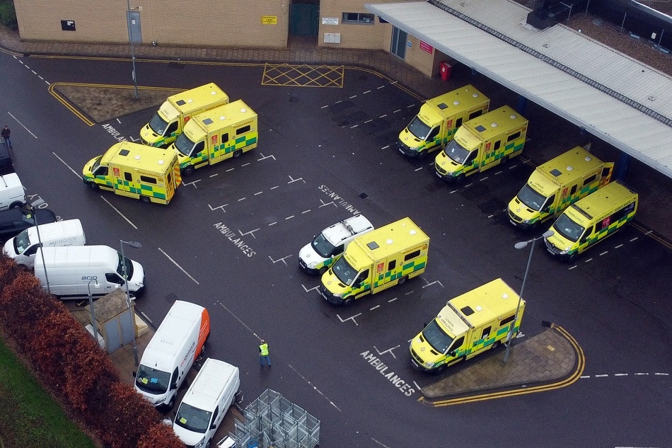 Ambulances are seen parked outside of the Queen’s Hospital in Romford, amid the spread of the coronavirus disease pandemic in London, January 11, 2022. Picture taken with a drone. Hannah McKay, Reuters