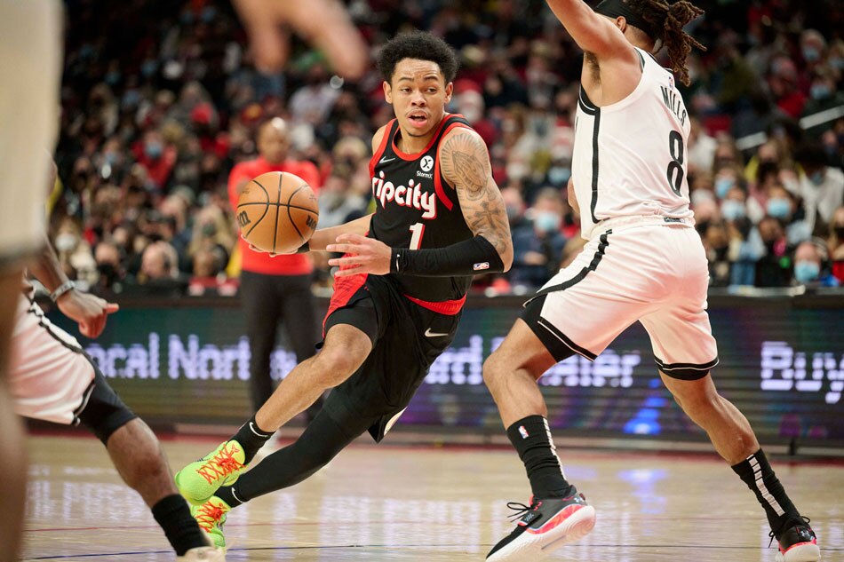 Portland Trail Blazers guard Anfernee Simons (1) drives to the basket during the second half against Brooklyn Nets guard Patty Mills (8) at Moda Center. Troy Wayrynen, USA TODAY Sports/Reuters.