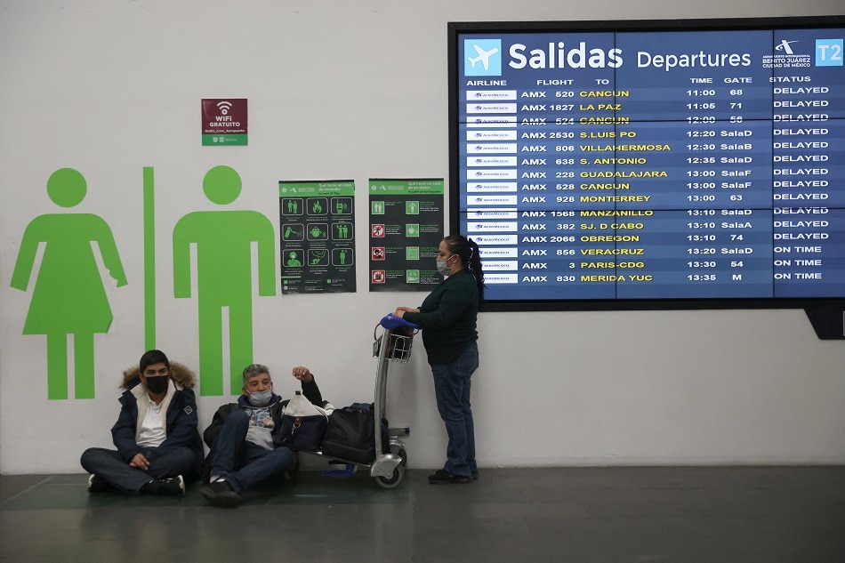 A screen shows flight information after more than 70 Grupo Aeromexico pilots have tested positive for COVID-19 as infections surge due to the omicron variant, at Benito Juarez international airport in Mexico City, January 7, 2022. Edgard Garrido, Reuters