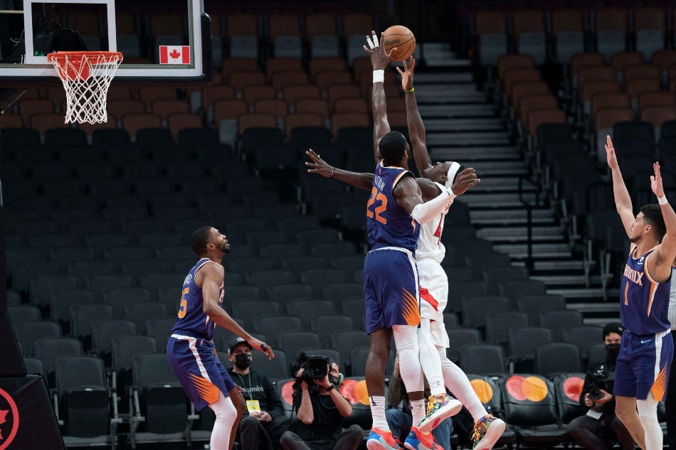 Toronto Raptors forward Pascal Siakam (43) drives to the basket as Phoenix Suns center Deandre Ayton (22) defends during the fourth quarter at Scotiabank Arena. Nick Turchiaro, USA TODAY Sports/Reuters.