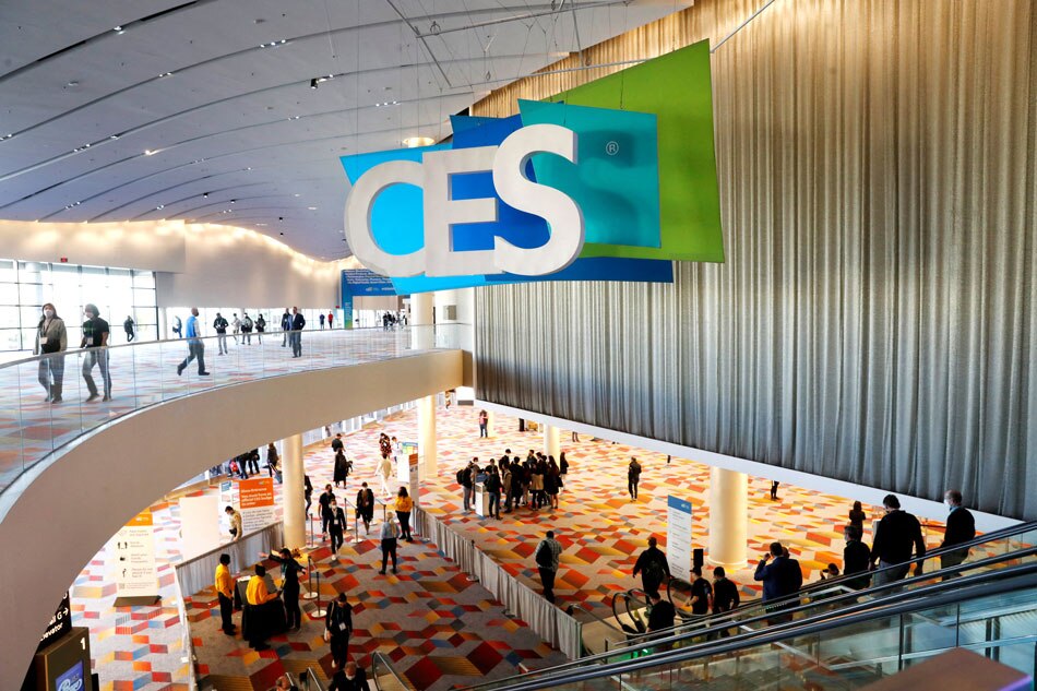 Attendees pass by a CES sign during CES 2022 in Las Vegas, Nevada, U.S. January 6, 2022. REUTERS/Steve Marcus/File Photo