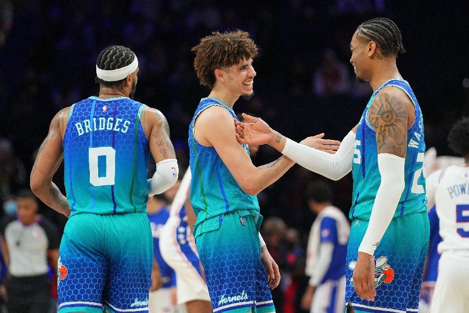 Charlotte Hornets guard LaMelo Ball (2) celebrates with forward P.J. Washington (25) after the game against the Philadelphia 76ers at the Wells Fargo Center. Mitchell Leff-USA TODAY Sports/Reuters