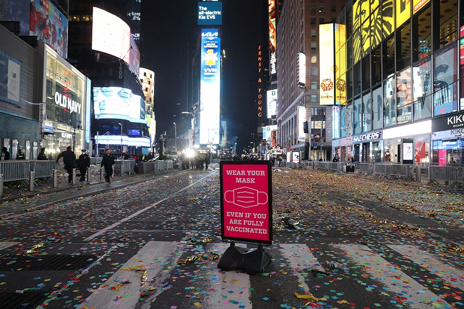 A sign stands amid confetti after the New Year's celebrations in Times Square, as the omicron COVID variant continues to spread, in the Manhattan borough of New York City, January 1, 2022. Hannah Beier, Reuters