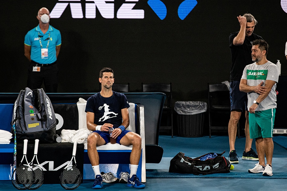 Serbian tennis player Novak Djokovic rests during a training session at Melbourne Park, as questions remain over the legal battle regarding his visa to play in the Australian Open in Melbourne, on January 14, 2022. Diego Fedele, AAP Image via Reuters