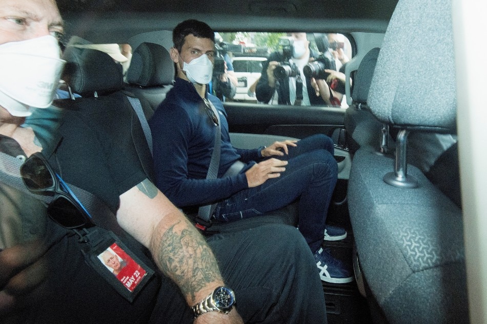 Serbian tennis player Novak Djokovic departs from the Park Hotel government detention facility before attending a court hearing at his lawyers office in Melbourne, Australia, January 16, 2022. James Ross, AAP Image via Reuters.