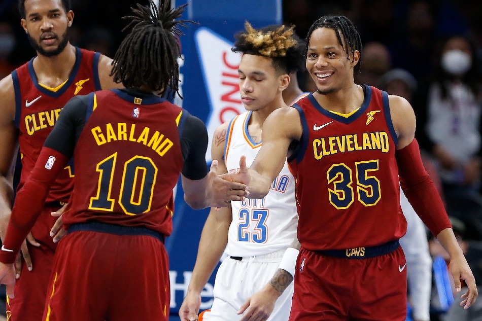 Cleveland Cavaliers forward Isaac Okoro (35) and guard Darius Garland (10) celebrate after scoring against the Oklahoma City Thunder during the second half at Paycom Center. Alonzo Adams, USA TODAY Sports/Reuters