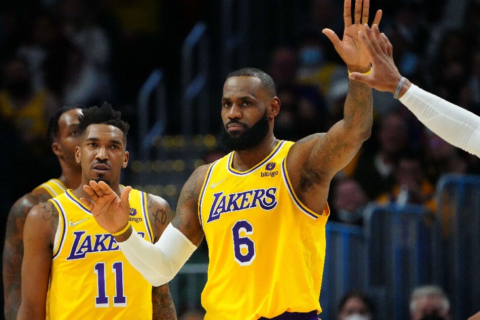 Los Angeles Lakers forward LeBron James (6) and guard Malik Monk (11) celebrate a score in the second quarter against the Denver Nuggets at Ball Arena. Ron Chenoy-USA TODAY Sports