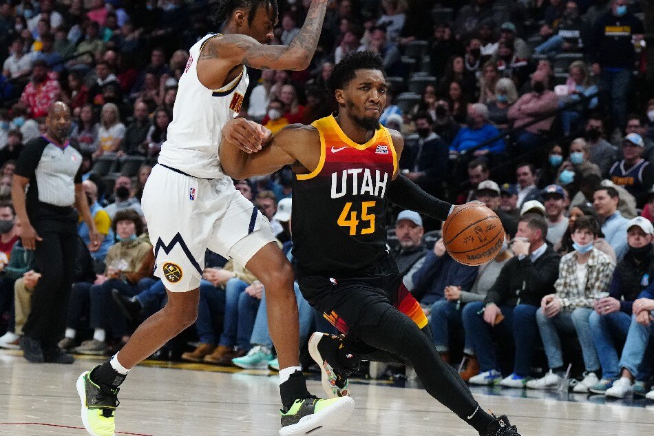 Utah Jazz guard Donovan Mitchell (45) drives past Denver Nuggets guard Bones Hyland (3) in the second quarter at Ball Arena. Ron Chenoy, USA TODAY Sports/Reuters