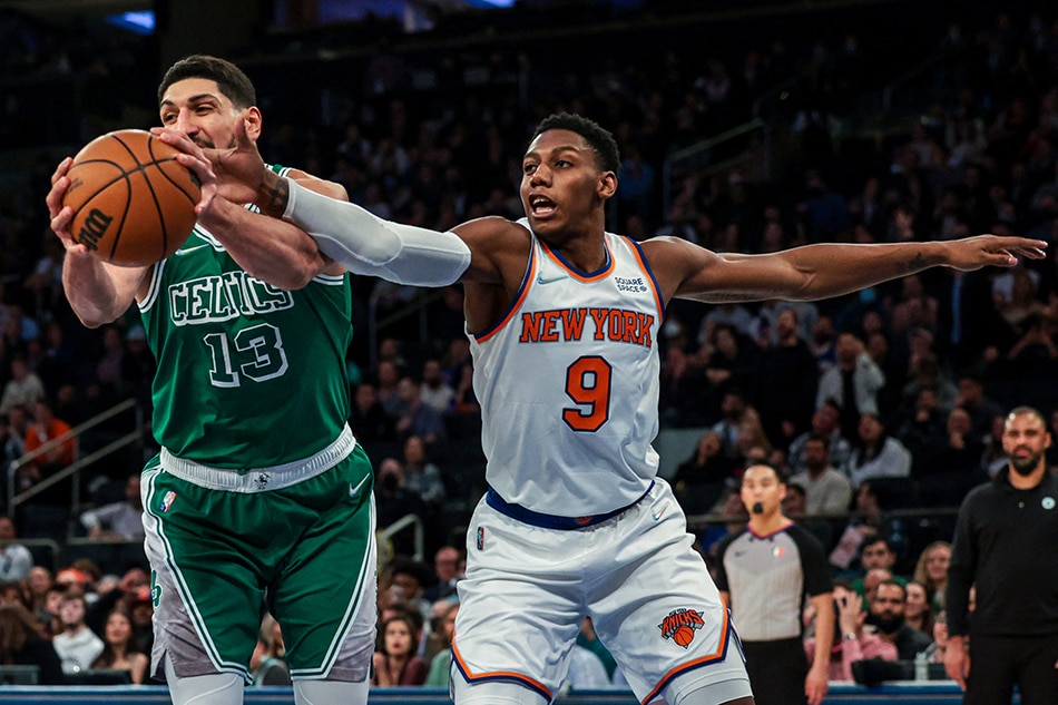 Boston Celtics center Enes Freedom (13) grabs a rebound against New York Knicks guard RJ Barrett (9) during the first half at Madison Square Garden. Vincent Carchietta, USA TODAY Sports/Reuters.