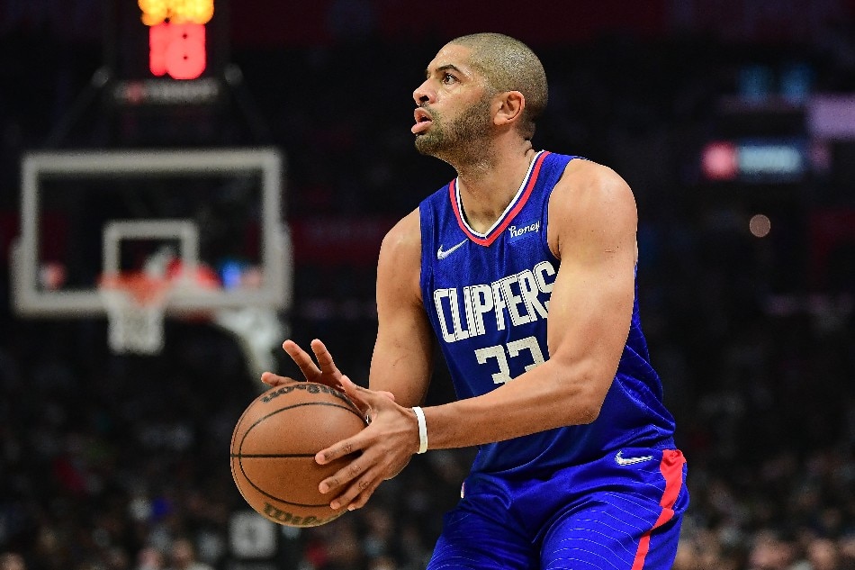 Clippers forward Nicolas Batum shoots during the first half in a December 20, 2021 game. Gary A. Vasquez, USA Today Sports/Reuters