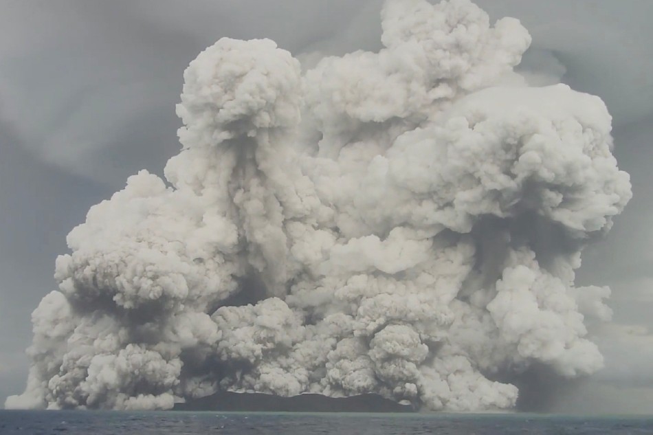 An eruption occurs at the underwater volcano Hunga Tonga-Hunga Ha'apai off Tonga, January 14, 2022 in this screen grab obtained from a social media video. Video recorded January 14, 2022. Tonga Geological Services via Reuters/file