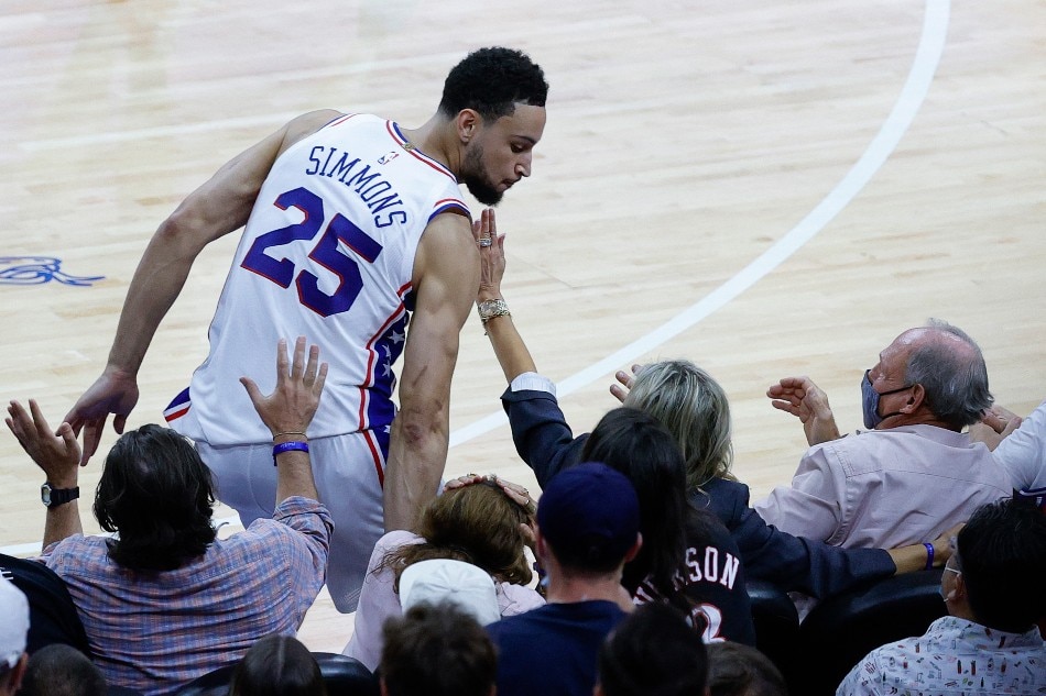 Ben Simmons (25) of the Philadelphia 76ers bumps into fans during the fourth quarter during Game Seven of the Eastern Conference Semifinals against the Atlanta Hawks at Wells Fargo Center on June 20, 2021 in Philadelphia, Pennsylvania. File photo. Tim Nwachukwu, Getty Images/AFP.