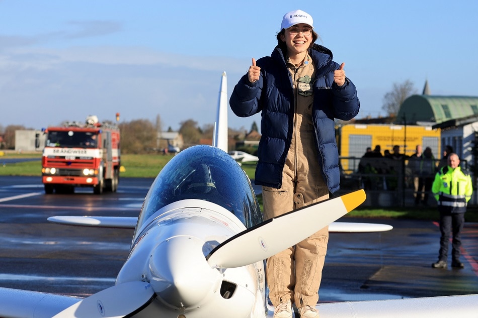 Belgian-British pilot Zara Rutherford, 19, gestures following her landing at Kortrijk-Wevelgem Airport in Wevelgem, Belgium, January 20, 2022, after a round-the-world trip in a light aircraft, becoming the youngest female pilot to circle the planet alone. Pascal Rossignol, Reuters