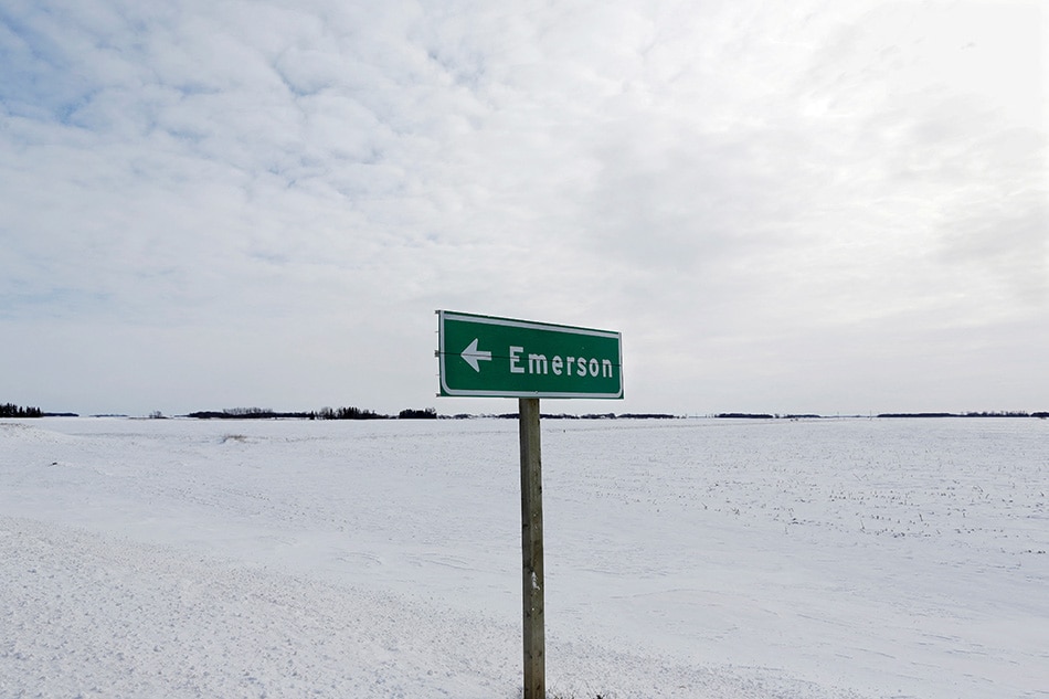 A sign post for the small border town of Emerson, near the Canada-US border crossing in Emerson, Manitoba, Canada, Feb. 1, 2017. Lyle Stafford, Reuters/File