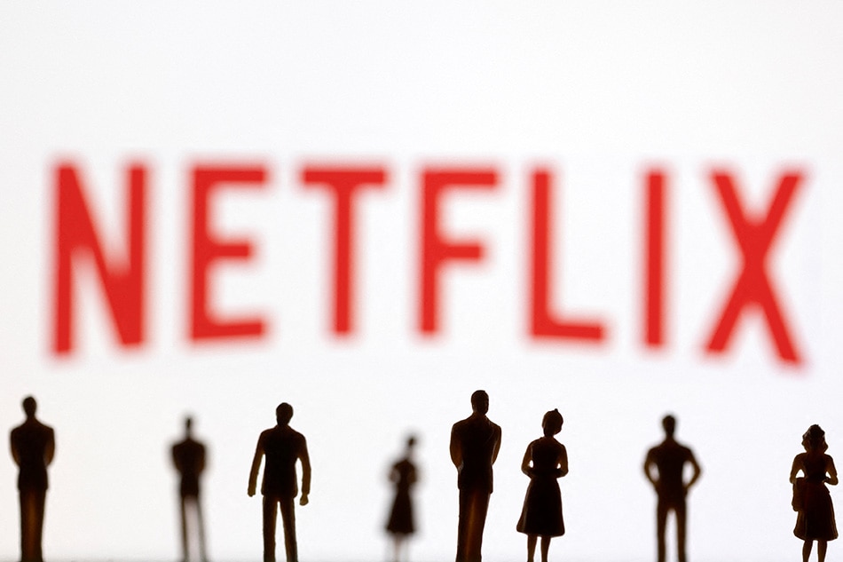 Toy figures of people are seen in front of the displayed Netflix logo, in this illustration taken January 20, 2022. Dado Ruvic, Reuters/Illustration