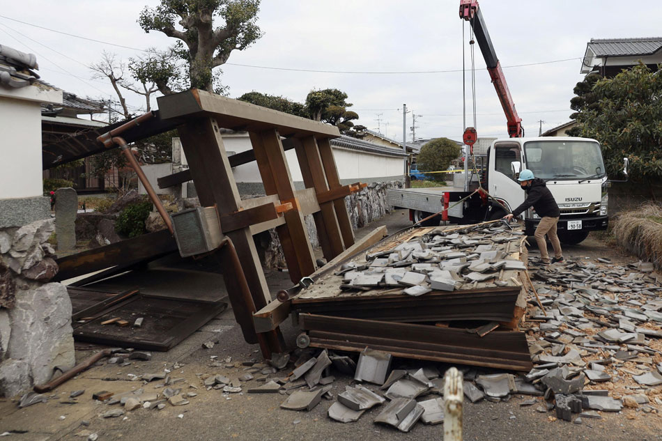 A collapsed gate at the residential house caused by an earthquake is seen in Oita, southern Japan on January 22, 2022, in this photo taken by Kyodo. Kyodo/via Reuters
