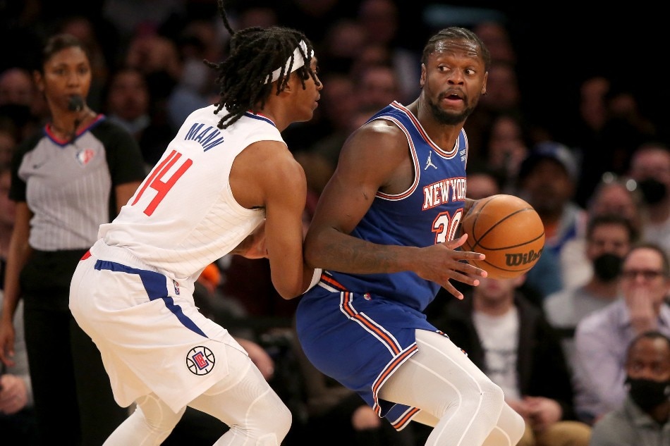 New York Knicks forward Julius Randle (30) controls the ball against Los Angeles Clippers guard Terance Mann (14) during the third quarter at Madison Square Garden. Brad Penner, USA TODAY Sports/Reuters.