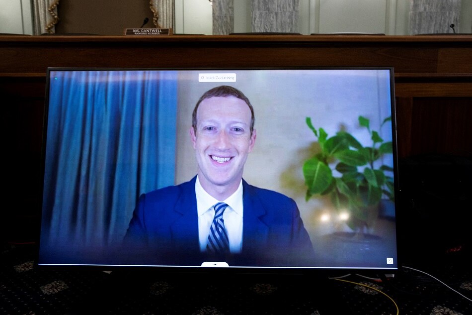 Facebook CEO Mark Zuckerberg appears on a monitor as he testifies remotely during a Senate commerce, science, and transportation committee hearing in Washington, DC, October 28, 2020. Michael Reynolds, pool via Reuters/file