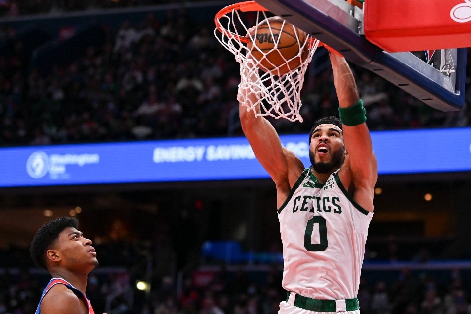 Boston Celtics forward Jayson Tatum (0) dunks as Washington Wizards forward Rui Hachimura (8) looks on during the second half at Capital One Arena. Tommy Gilligan, USA TODAY Sports/Reuters