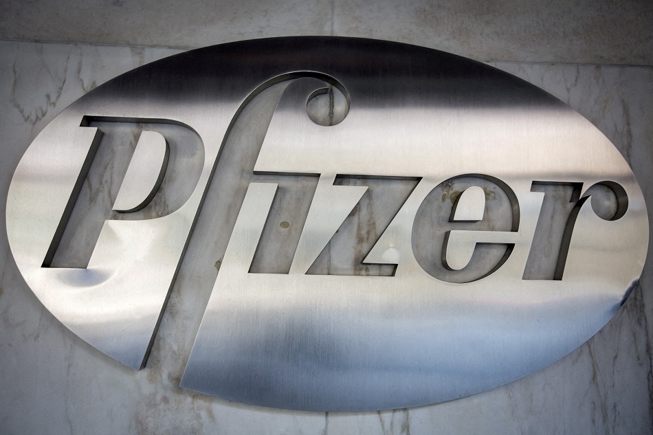 The Pfizer logo is pictured at their building in the Manhattan borough of New York October 29, 2015. Pfizer has said recently that 2 doses of the original vaccine may not be sufficient to protect against infection from the omicron variant. Carlo Allegri, Reuters/file