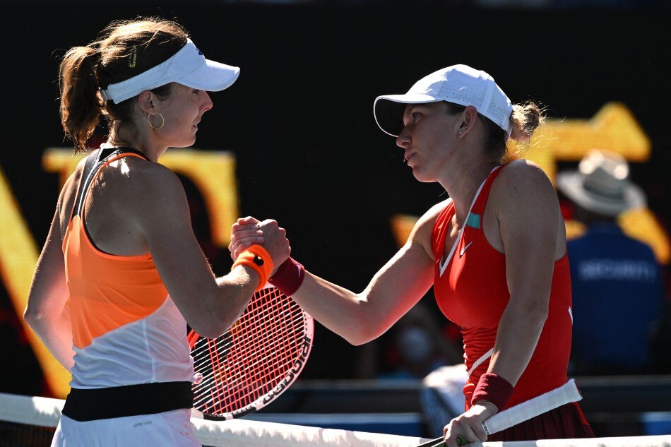France's Alize Cornet and Romania's Simona Halep shake hands after their fourth round match. Morgan Sette, Reuters.