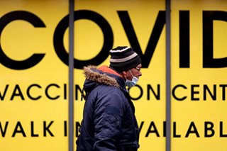 As omicron ebbs, England revives plan of living with COVID