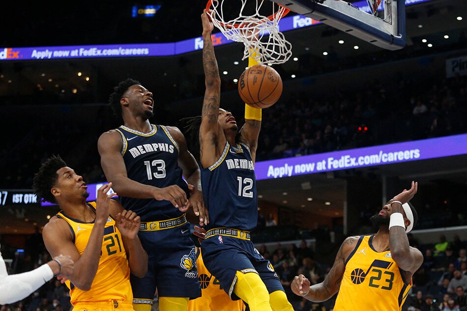 Grizzles guard Ja Morant dunks in Memphis’ game against Utah on January 28, 2022. Petre Thomas, USA Today Sports/Reuters