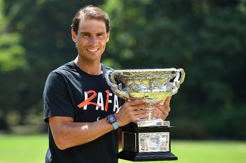 Nadal poses with the Norman Brookes Challenge Cup trophy in Melbourne on January 31, 2022 after winning the Australian Open. Joel Carrett, AAP Image via Reuters
