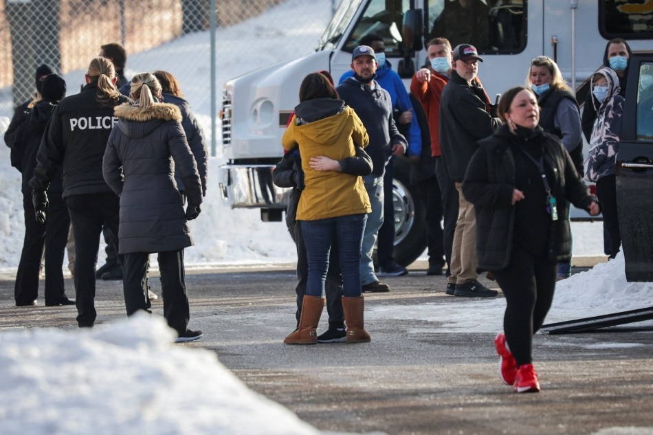 Parents are reunited with their children after a shooting took place outside of the South Education Center school in Richfield, Minnesota, US, Feb. 1, 2022. Christian Monterrosa, Reuters