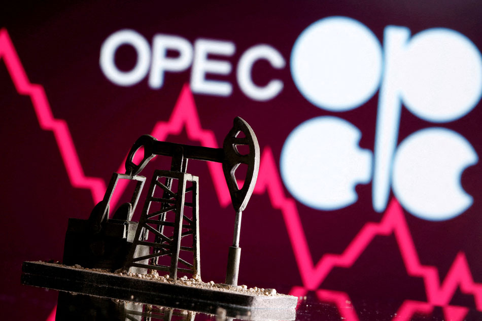 A 3D printed oil pump jack is seen in front of displayed stock graph and Opec logo in this illustration picture, April 14, 2020. Dado Ruvic, Reuters/Illustration/File Photo