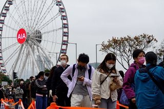 Hong Kong residents queue for COVID-19 testing