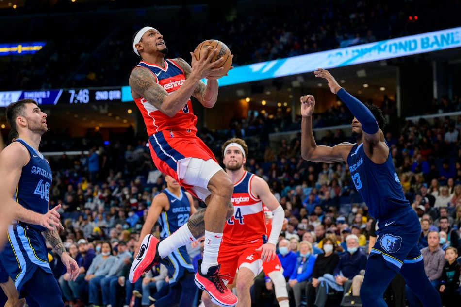 Washington Wizards guard Bradley Beal (3) drives to the basket past forward Jaren Jackson Jr. (13) during the second quarter at the FedExForum. Jerome Miron, USA TODAY Sports/Reuters.