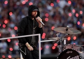 Eminem kneels at Super Bowl's high-wattage hip-hop halftime show