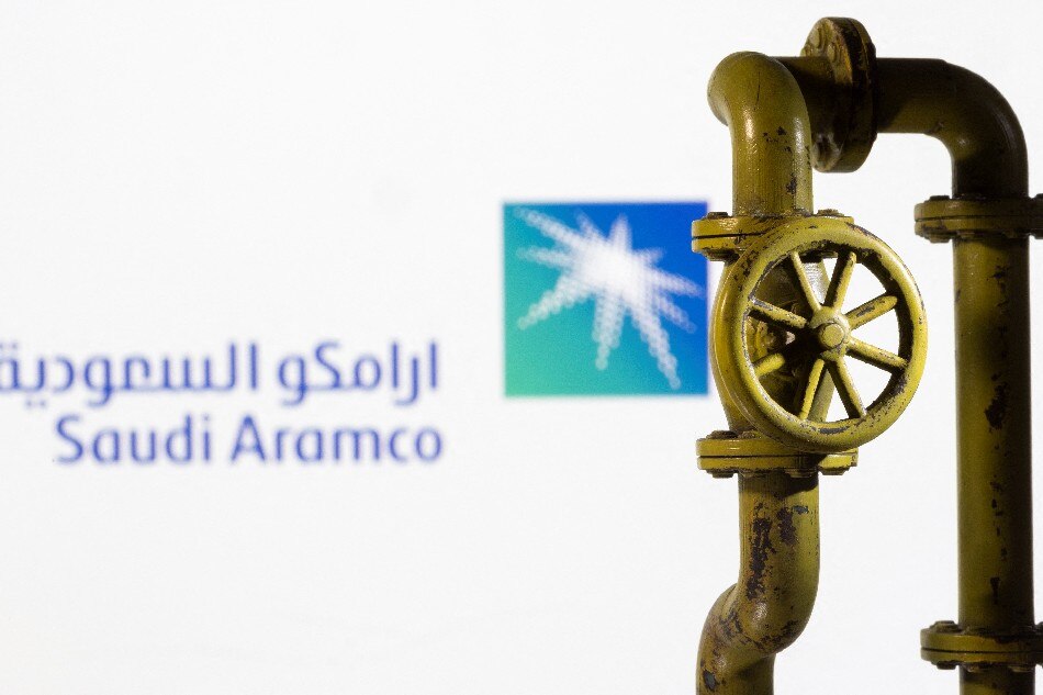 A 3D printed natural gas pipeline is placed in front of displayed Saudi Aramco logo in this illustration taken February 8, 2022. Dado Ruvic, Reuters/Illustration