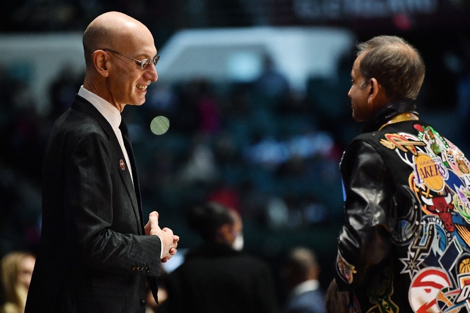 NBA commissioner Adam Silver talks with a fan during the first half of the Ruffles NBA All-Star Celebrity Game at the Wolstein Center. Ken Blaze/Reuters