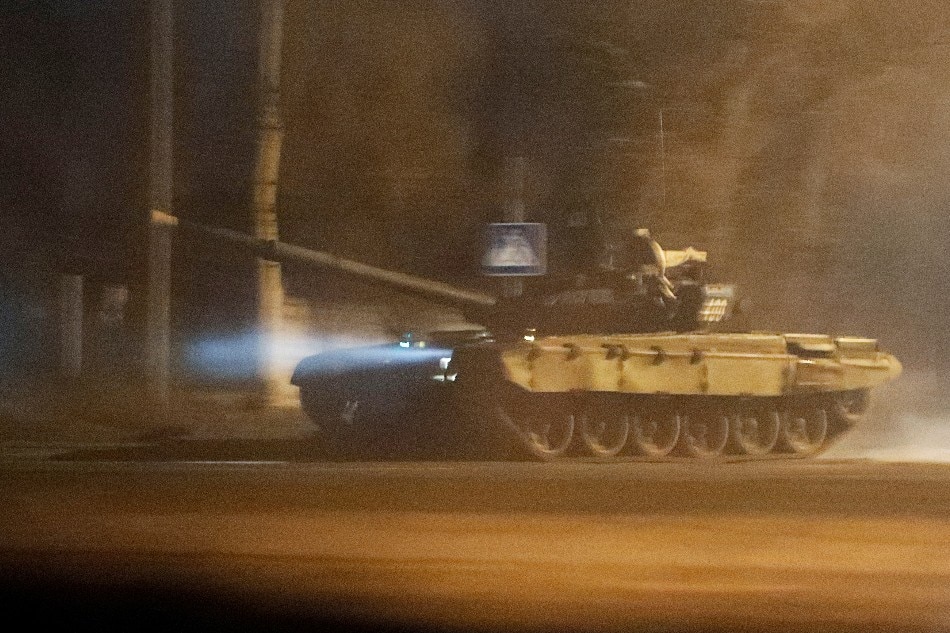 A tank drives along a street after Russian President Vladimir Putin ordered the deployment of Russian troops to two breakaway regions in eastern Ukraine following the recognition of their independence, in the separatist-controlled city of Donetsk, Ukraine February 22, 2022. Alexander Ermochenko, Reuters