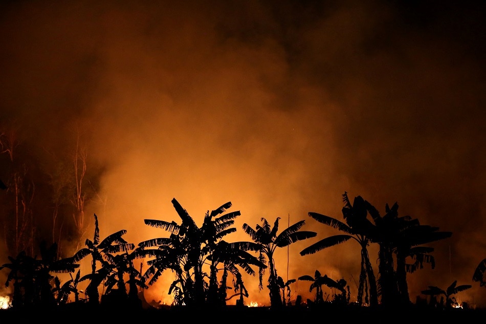 A fire burns a tract of Amazon jungle near Porto Velho, Brazil, September 9, 2019. Picture taken September 9, 2019. Bruno Kelly, Reuters/file