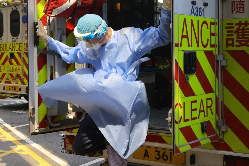 A paramedic takes patients to Queen Elizabeth Hospital in Jordan in Hong Kong. Photo: Dickson Lee, South China Morning Post