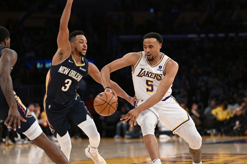 New Orleans Pelicans guard CJ McCollum (3) defends a pass by Los Angeles Lakers guard Talen Horton-Tucker (5) in the first half at Crypto.com Arena. Jayne Kamin-Oncea, USA TODAY Sports/Reuters.