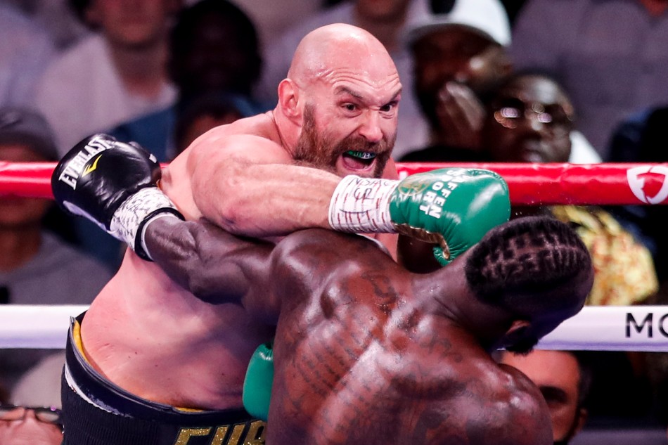 Tyson Fury of England (L) in action against Deontay Wilder of the USA during their 12 rounds WBC heavyweight world championship title fight at the T-Mobile arena in Las Vegas, Nevada, USA, 09 October 2021. Etienne, Laurent, EPA-EFE.
