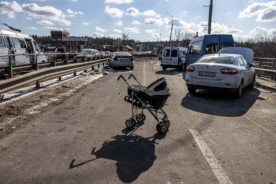 An abandoned stroller stands on a destroyed bridge as people flee from the frontline town of Irpin, Kyiv in Ukraine on Thursday. Thousands of residents are fleeing Irpin and Bucha, as well as other settlements near Kyiv which were the most affected by the Russian army invasion. Roman Pilipey, EPA-EFE