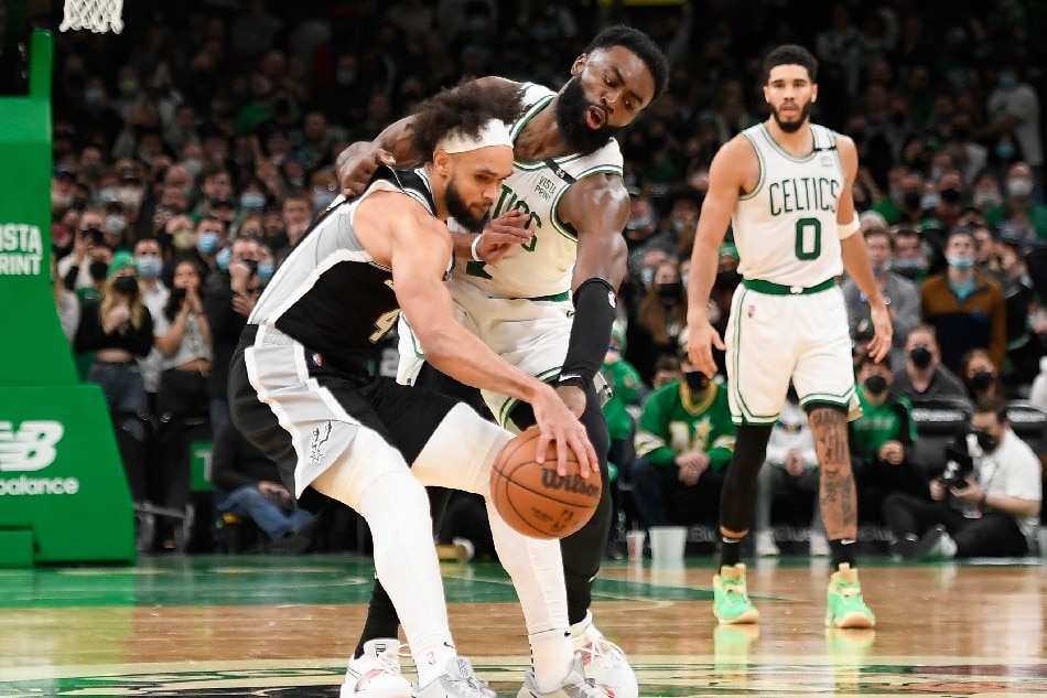 Boston Celtics guard Jaylen Brown (7) steals the ball away from San Antonio Spurs guard Derrick White (4) during the second half at TD Garden. Bob DeChiara, USA TODAY Sports via Reuters