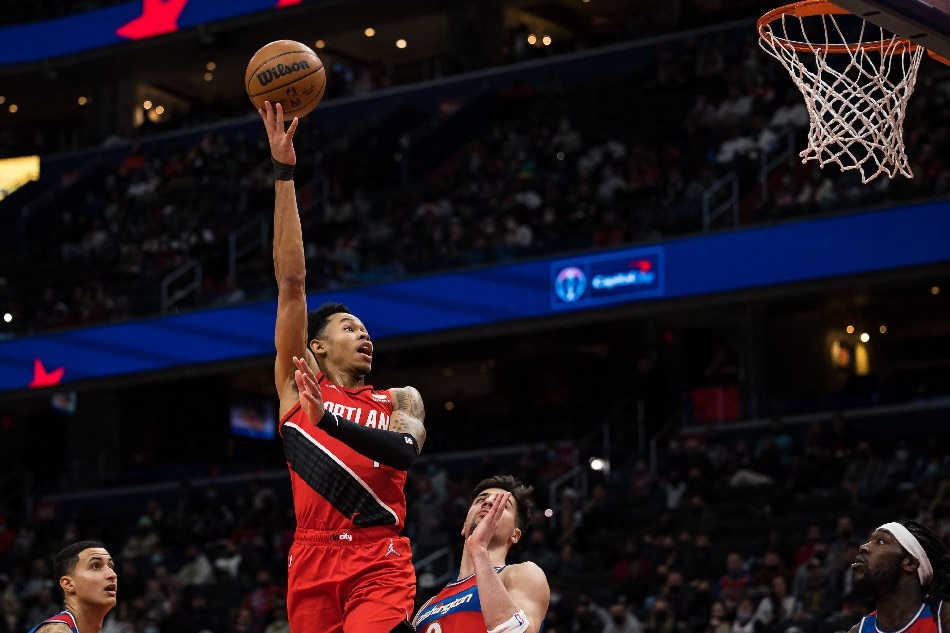 Portland Trail Blazers guard Anfernee Simons (1) shoots the ball over Washington Wizards forward Deni Avdija (9) during the first half at Capital One Arena. Scott Taetsch, USA TODAY Sports/Reuters.