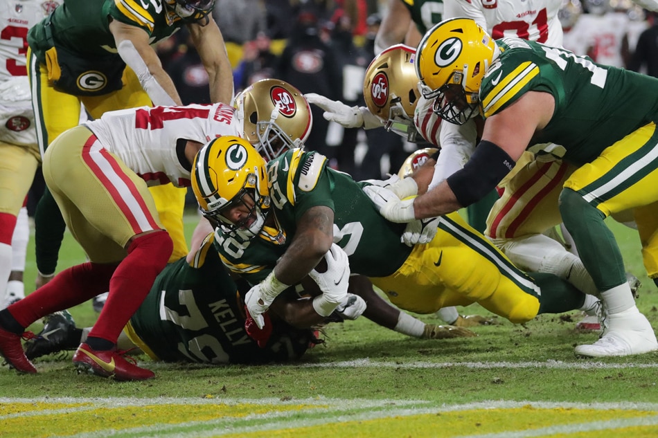 Green Bay Packers running back A.J. Dillon (28) scores a touchdown in the first quarter against the San Francisco 49ers during the NFC Divisional playoff football game at Lambeau Field. Mark Hoffman, USA Today Network/Reuters.