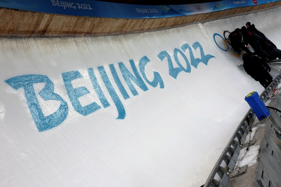 Ice makers install a sub-glacial Olympic logo ahead of the Beijing 2022 Winter Olympics at Yanqing National Sliding Centre in Yanqing, China, January 28, 2022. Edgar Su, Reuters