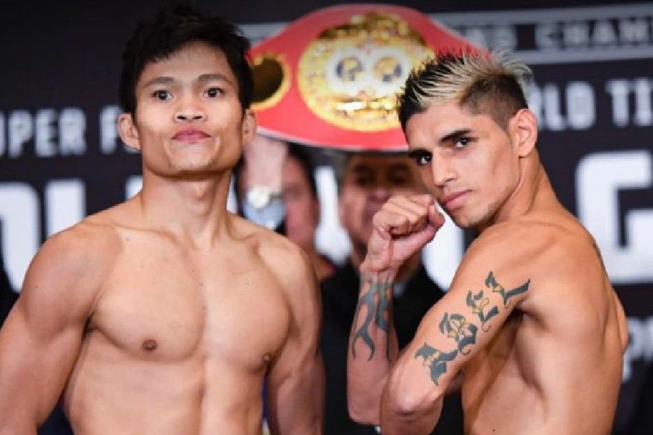 Filipino champion Jerwin Ancajas and Fernando Martinez pose during the weigh in. Photo from Joven Jimenez