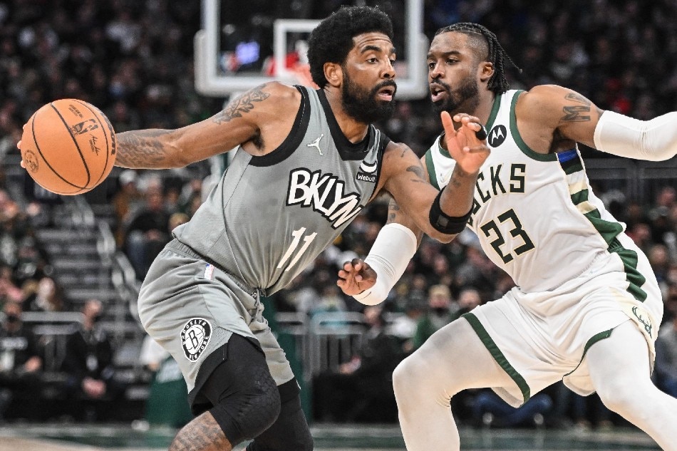 Brooklyn Nets guard Kyrie Irving (11) drives against Milwaukee Bucks guard Wesley Matthews (23) in the third quarter at Fiserv Forum. Benny Sieu, USA TODAY Sports/Reuters.