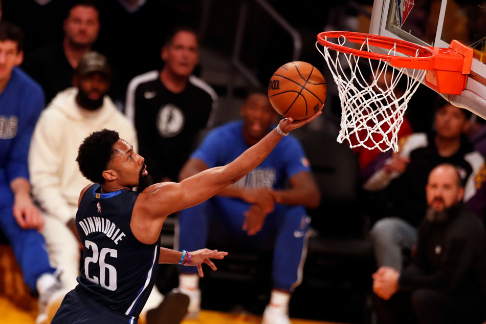 Dallas Mavericks guard Spencer Dinwiddie scores during the first quarter of the NBA basketball game between the Los Angeles Lakers and the Dallas Mavericks at the Crypto.com Arena in Los Angeles, California, USA, 01 March 2022. File photo. Etienne Laurent, EPA-EFE