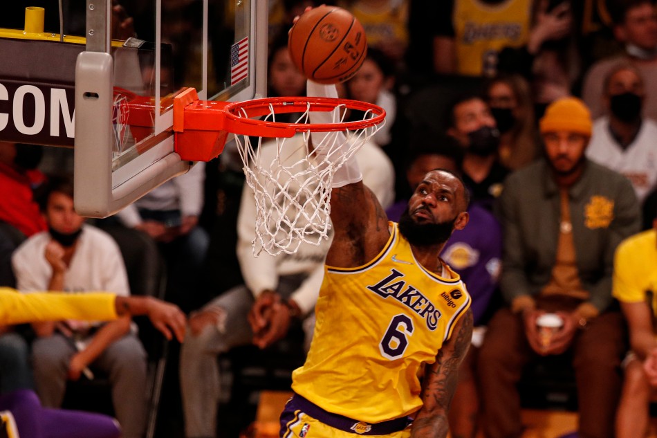 Los Angeles Lakers forward LeBron James scores during the third of the NBA game between the Los Angeles Lakers and the Milwaukee Bucks at the Crypto.com Arena in Los Angeles, California, USA, 08 February 2022. File photo. Etienne Laurent, EPA-EFE.