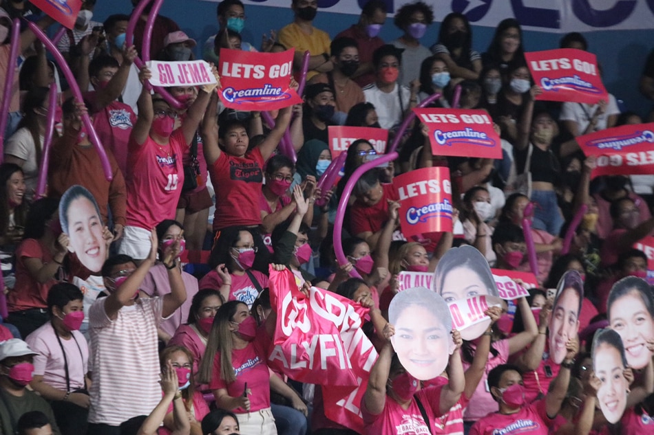 Fans of the Creamline Cool Smashers cheer for their team against the Chery Tiggo Turnovers in their PVL Open Conference quarterfinals game. PVL Media